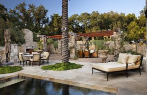 Pool - huge mediterranean backyard stone and custom-shaped infinity pool idea in Austin
