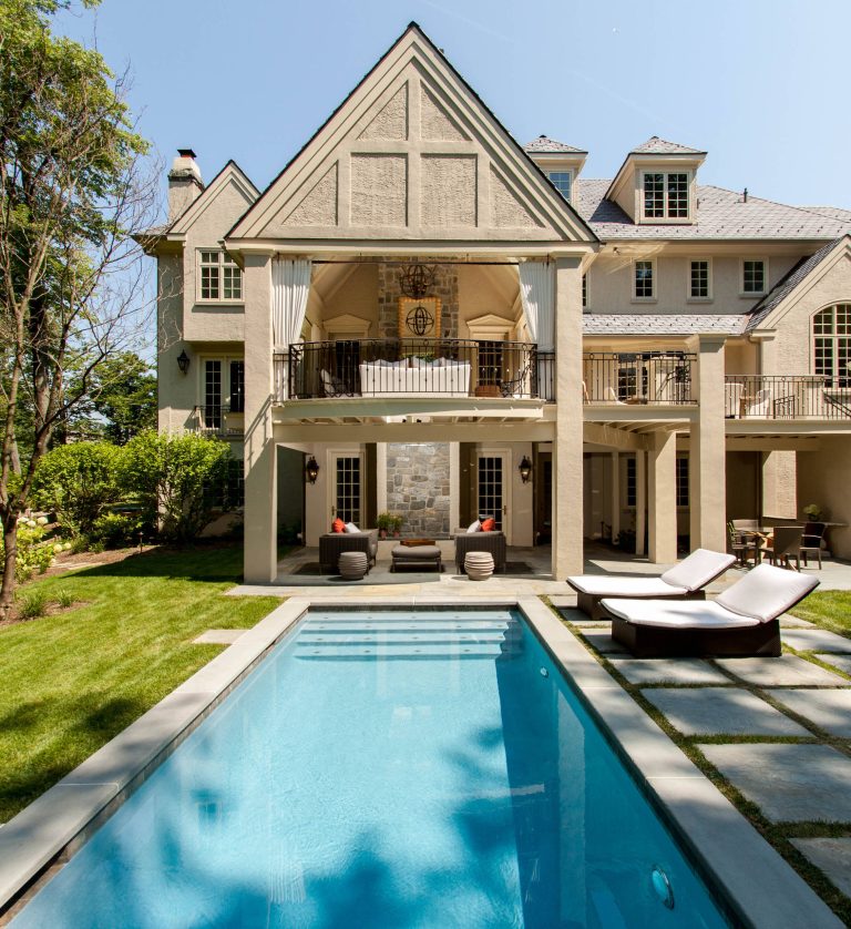 Pool - huge traditional backyard stone and rectangular lap pool idea in Philadelphia