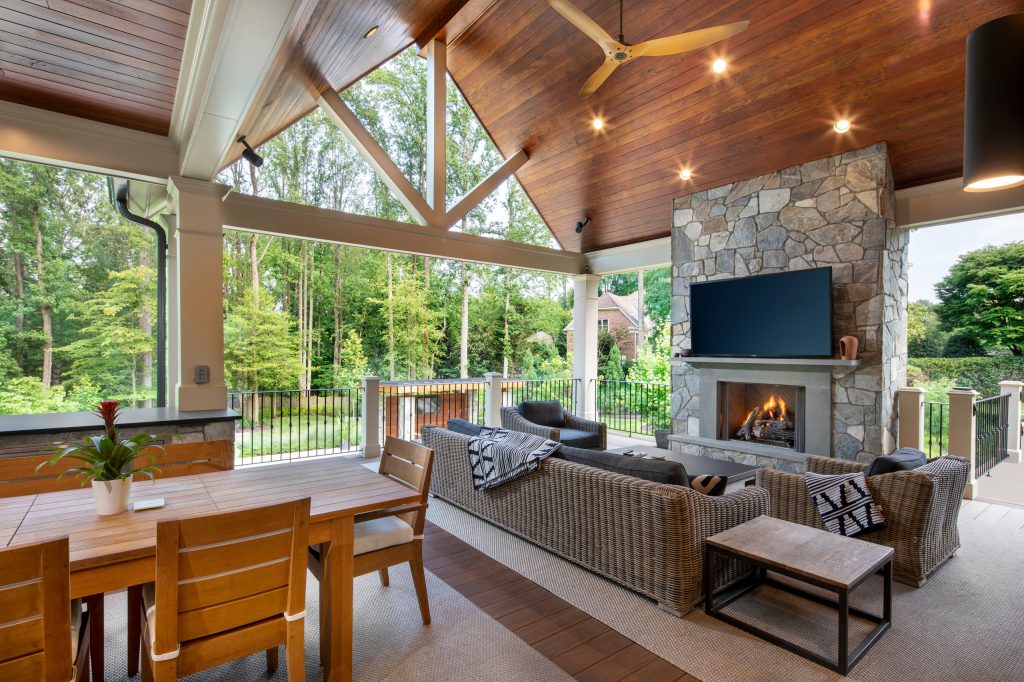 Pool landscaping and hardscape with pergola and covered deck