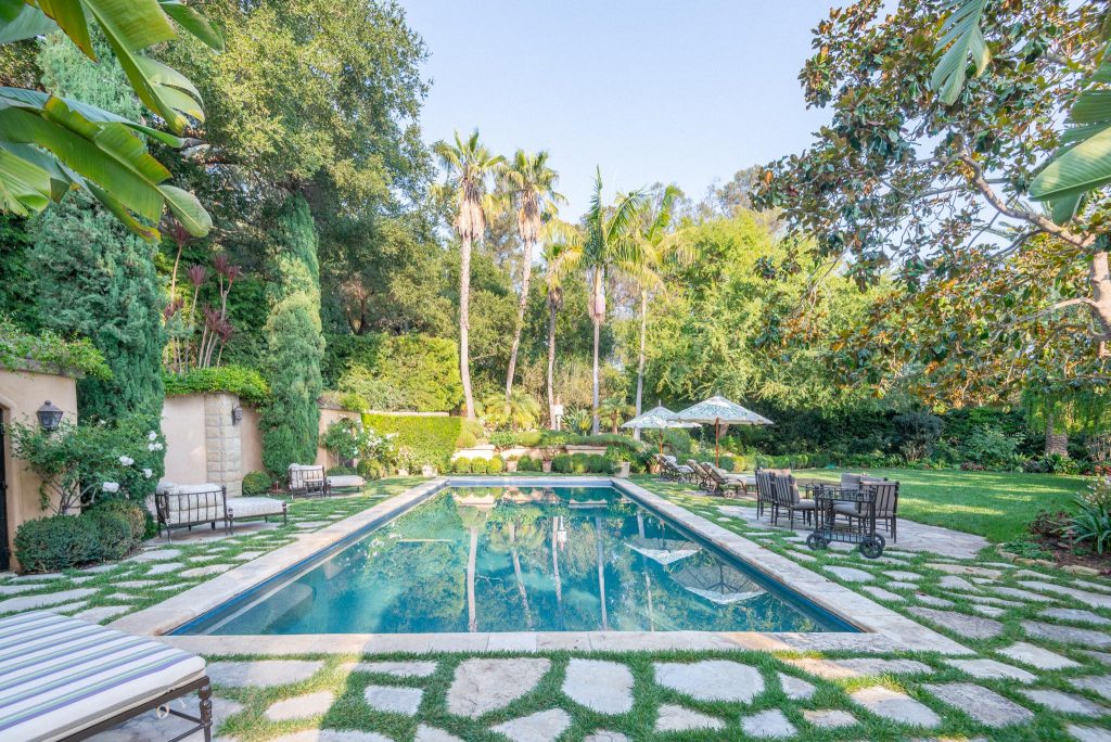 Pool landscaping - huge mediterranean backyard stone and rectangular pool landscaping idea in Santa Barbara