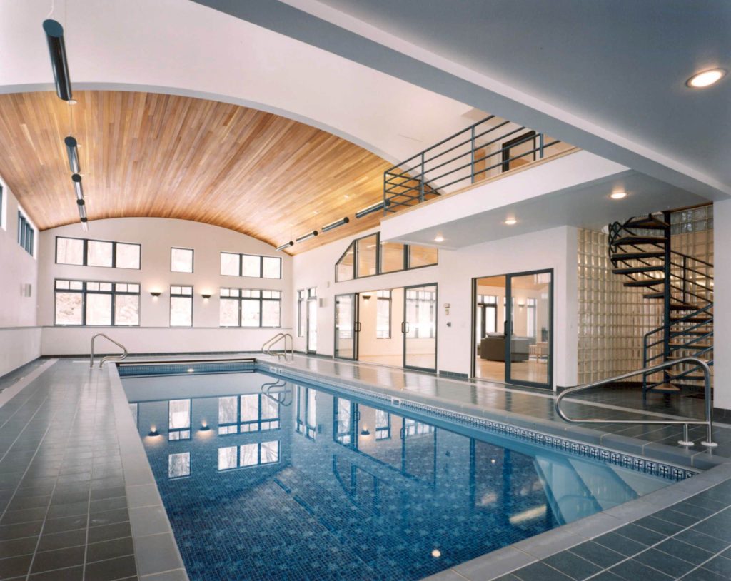 Pool - large contemporary indoor tile and rectangular lap pool idea in Other