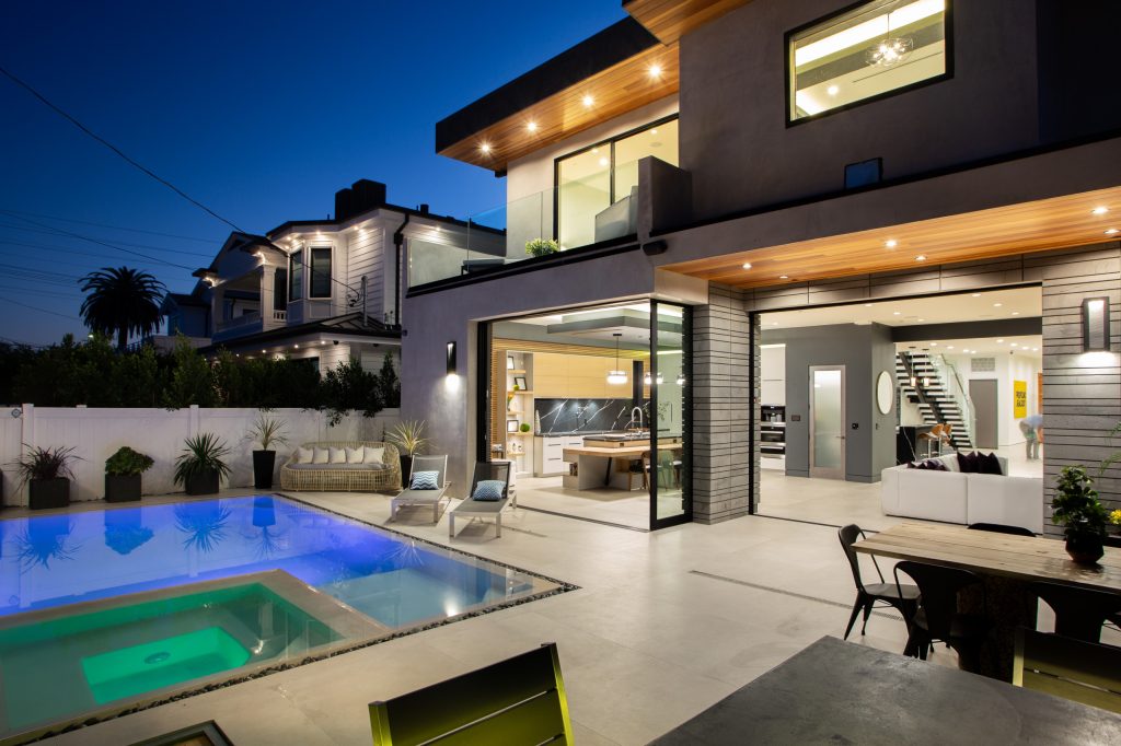 Pool - large modern backyard concrete and rectangular lap and privacy pool idea in Los Angeles