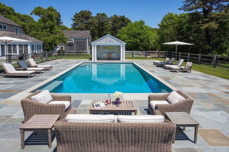 Pool - large traditional backyard rectangular and concrete paver lap pool idea in Boston