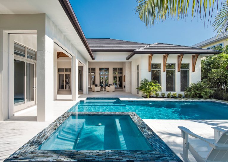 Pool - mid-sized backyard custom-shaped pool idea in Other