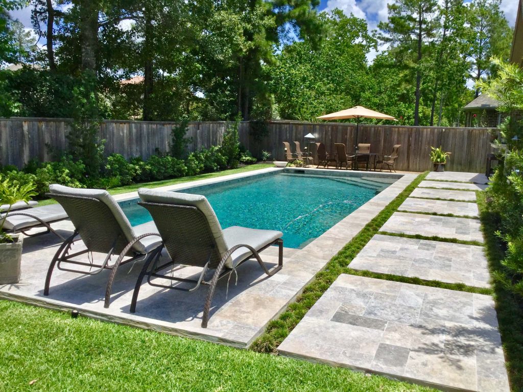 Pool - mid-sized contemporary backyard stone and rectangular lap pool idea in Houston