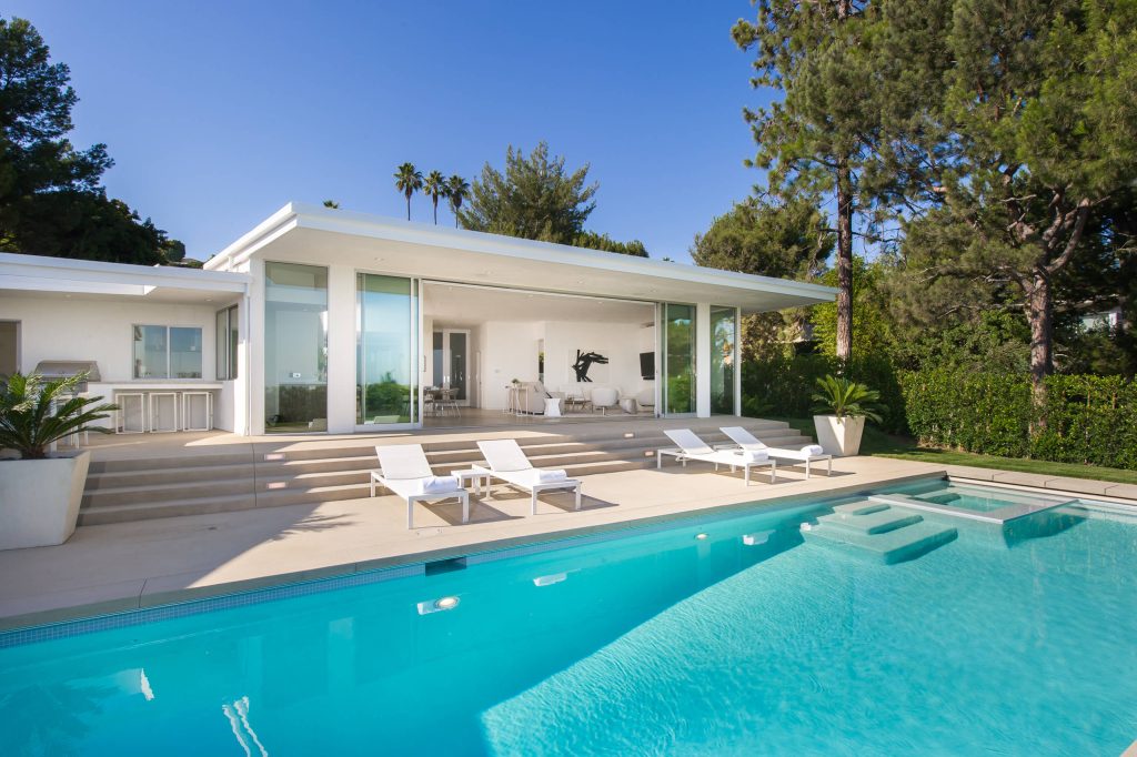 Pool - modern backyard concrete and rectangular pool idea in Los Angeles
