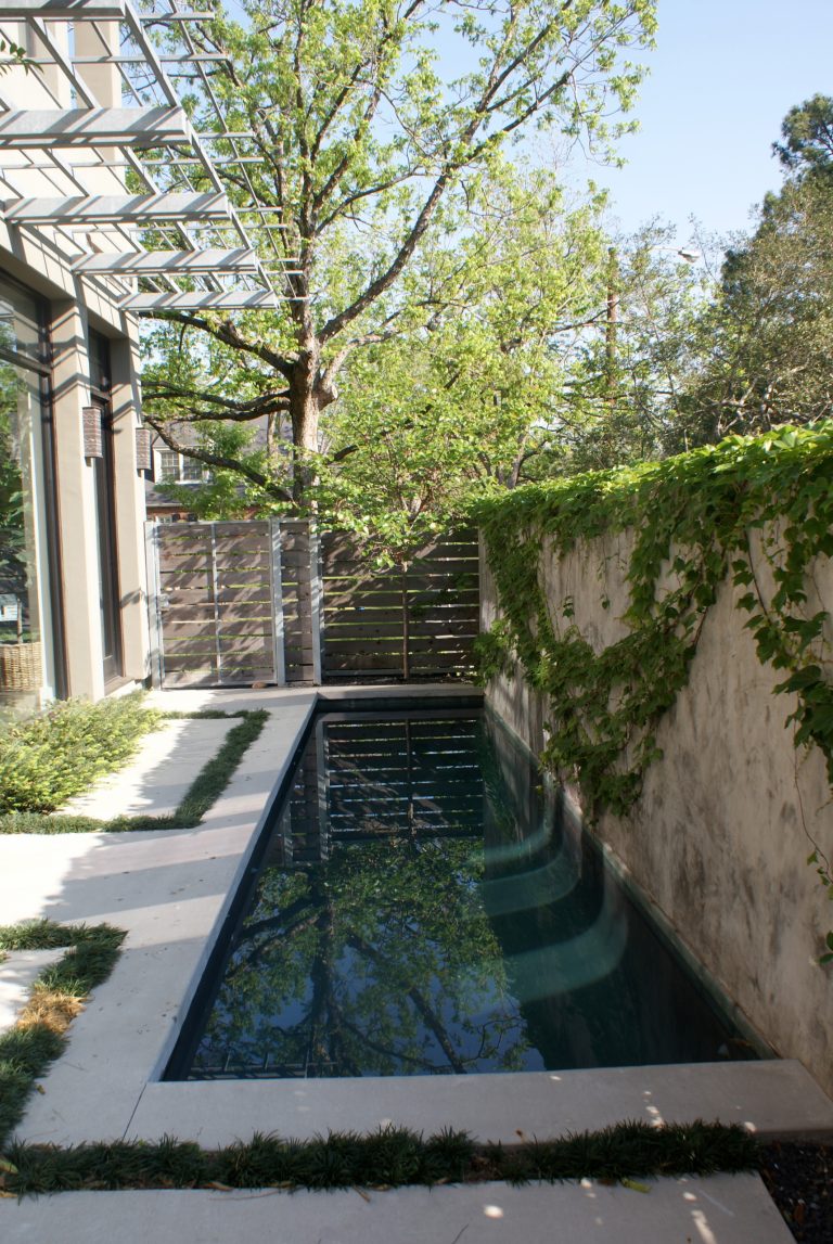 Pool - small modern side yard concrete and rectangular lap pool idea in Houston