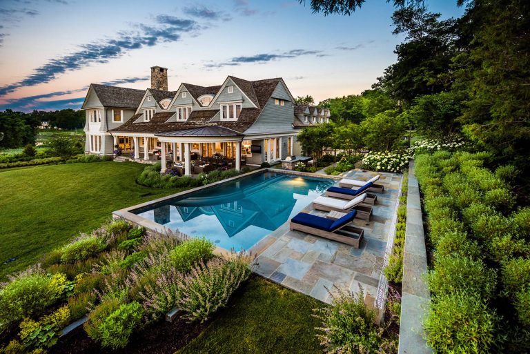 Pool - traditional backyard stone and rectangular aboveground pool idea in New York