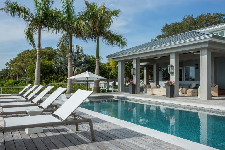 Pool - transitional rectangular pool idea in Orlando with decking