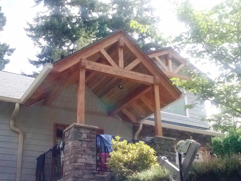 Porch addition with a Craftsman style and a heavy timber feel
