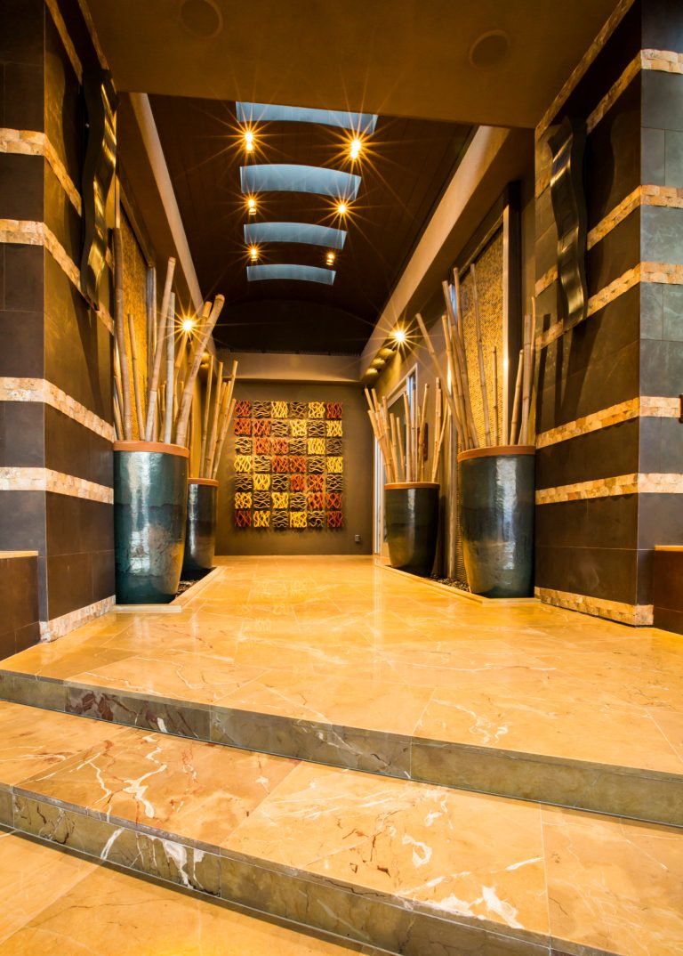 Porch is full of elements such as waterfall on either side, prominent art, skylight, stripped columns etc. Actual front door is on the right side as that is where the strip view is. by Pravin Bakrania | Outdoor Photos | Porch | Landscaping | Landscape Design | Outdoor Living Space | Porch Design Ideas | Outdoor Living Space Ideas | Backyard Design