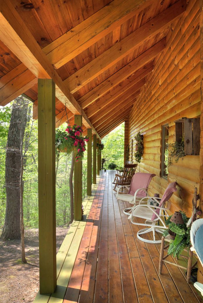 Porch of Log Cabin Home by Hochstetler Log Homes