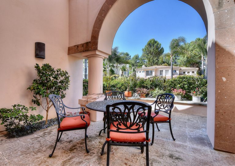 Porch photo in Orange County by RE/MAX Fine Homes | Outdoor Photos | Porch | Landscaping | Landscape Design | Outdoor Living Space | Porch Design Ideas | Outdoor Living Space Ideas | Backyard Design