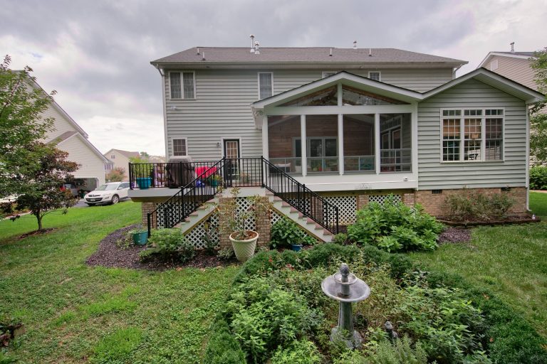 Porch/deck hybrid with double staircase