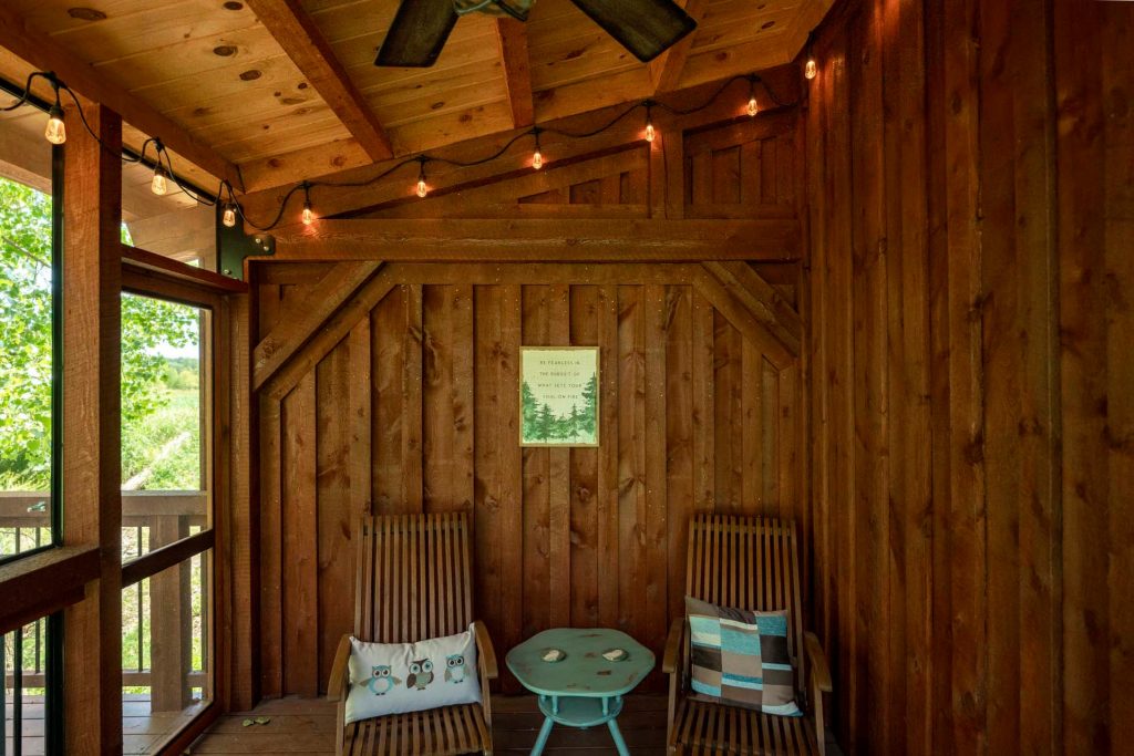 Post and beam covered porch with ceiling fan