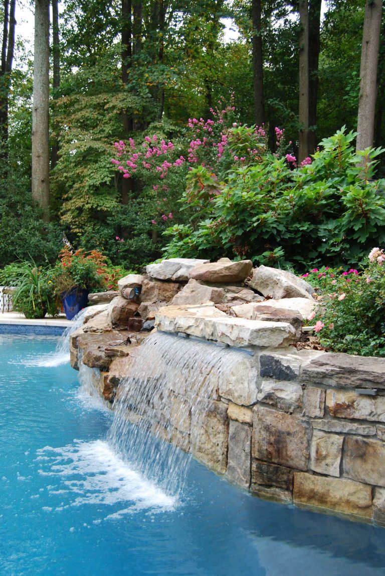 Potted plants in brightly colored cobalt containers pull the design accents together with the pool and surround. Design: Andrea Hickman of A.HICKMAN Design; Photography: Andrea Hickman