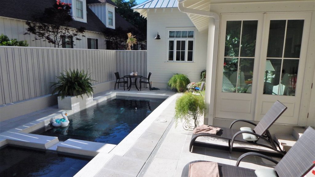 Private pool and patio area nestled in back yard. Photo by Tom Aiken
