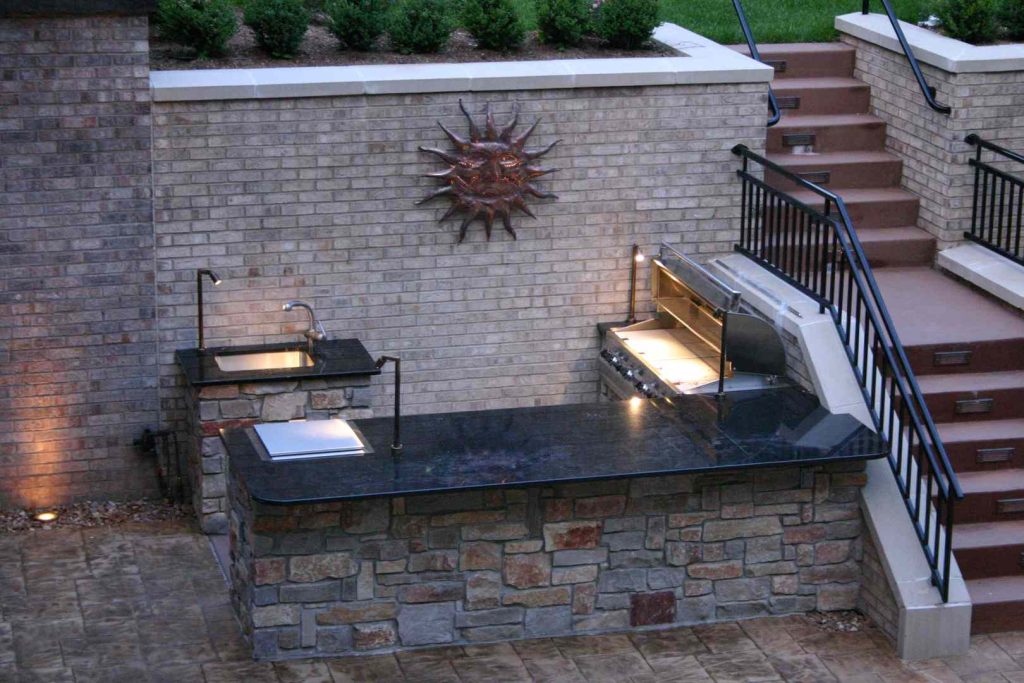 Project consisted of a poolside L-shaped kitchen with natural stone veneer and granite countertops.