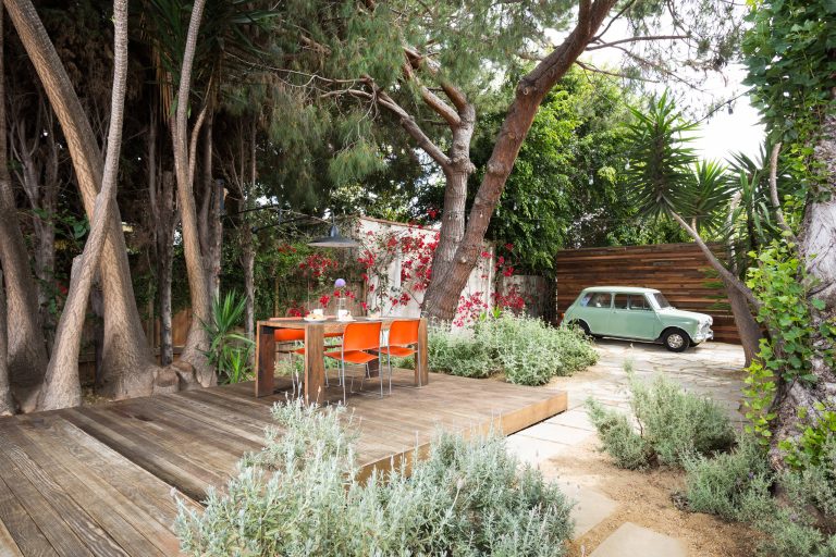 Raised dining deck with driveway beyond. Photo by Clark Dugger