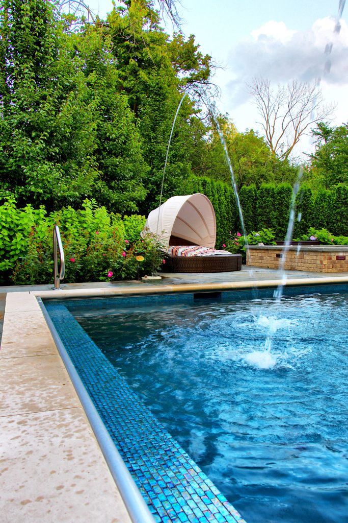 Rectangular in-ground swimming pool with simple landscape accent plantings. French Inspired Theme. By: Arrow. Land + Structures. Landscape Architects and Builders by Arrow. Land + Structures | Pool design | Pool Contracting | Swimming Pool Ideas | Swimming Pool Design Ideas