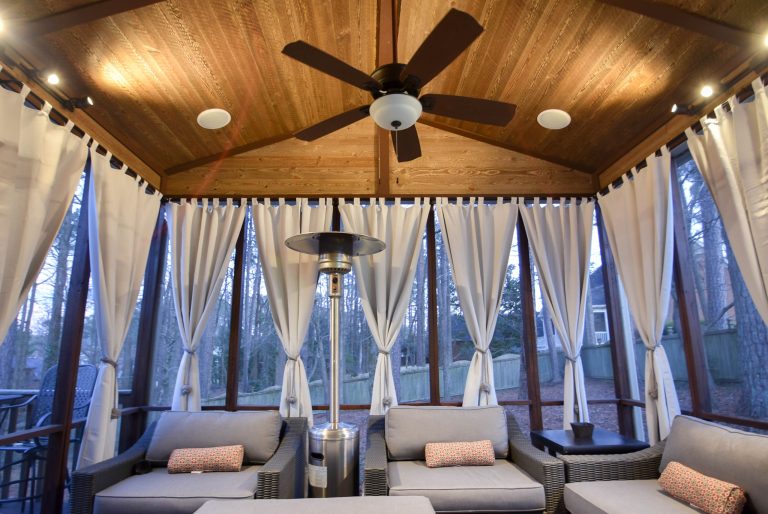 Redesign screened in porch project. Raised roof from 9ft to 12ft. with Barnwood tongue and grove boards. Replacements of screens with new stained trim.