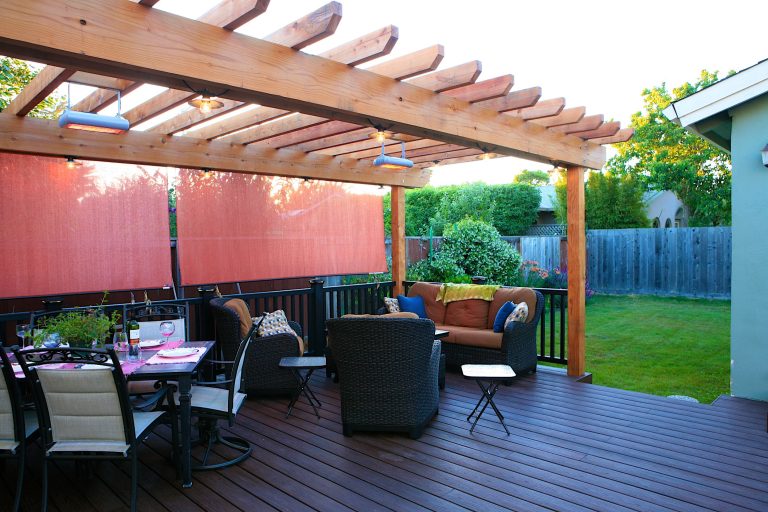 Redwood trellis, trex decking and railing, and custom lighting make this a stunning space.