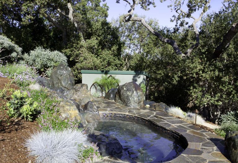 Remodeled outdoor spa using Yuba Blue Stone. New pool equipment shed in background.