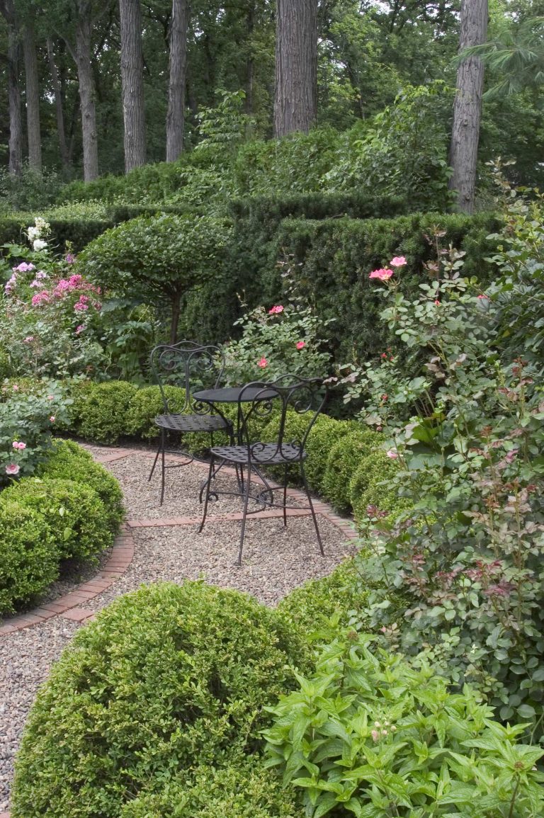 Request Free Quote Plant bed ideas with garden path and cafe table and chairs in Winnetka, IL. by Schmechtig Landscapes