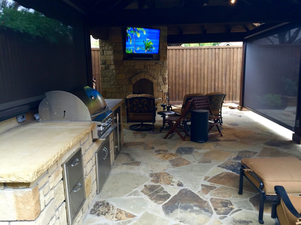 Rough cedar Oklahoma flagstone Milsap stone fireplace Milsap outdoor kitchen Pool remodel Sun shade