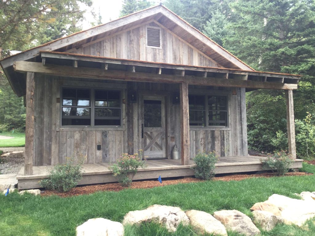 Rustic Wood Hub's milled corral board and antique hand hewn timbers create this perfect rustic porch.