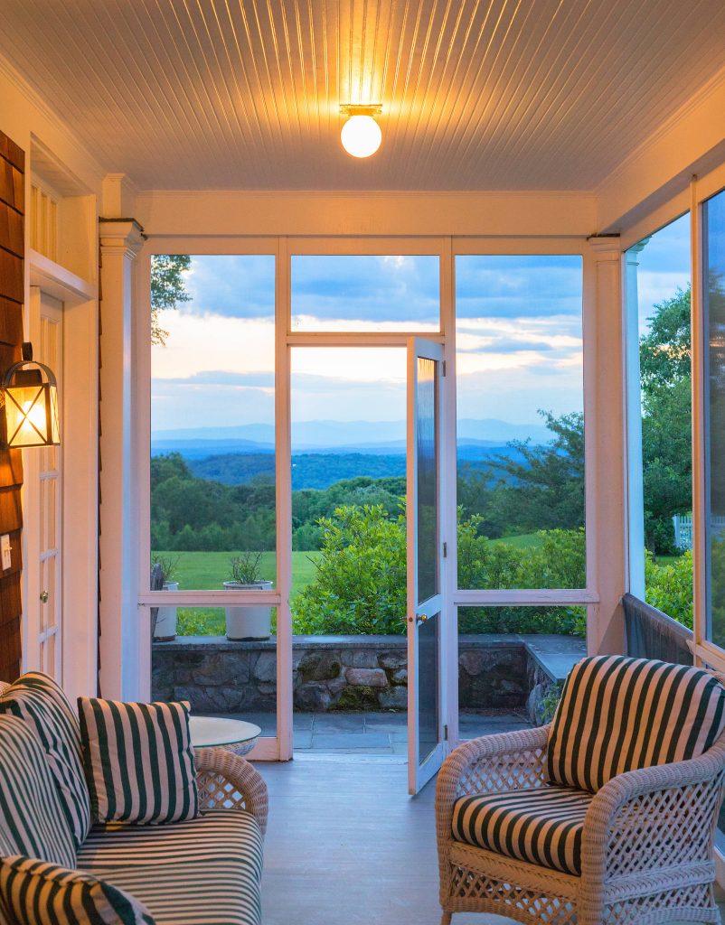 Screen porch off living room overlooking pool and view Aaron Thompson photographer