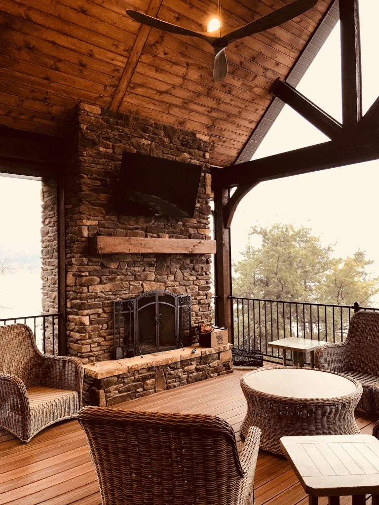 Screened Porch Masonary Fireplace and exposed beams.