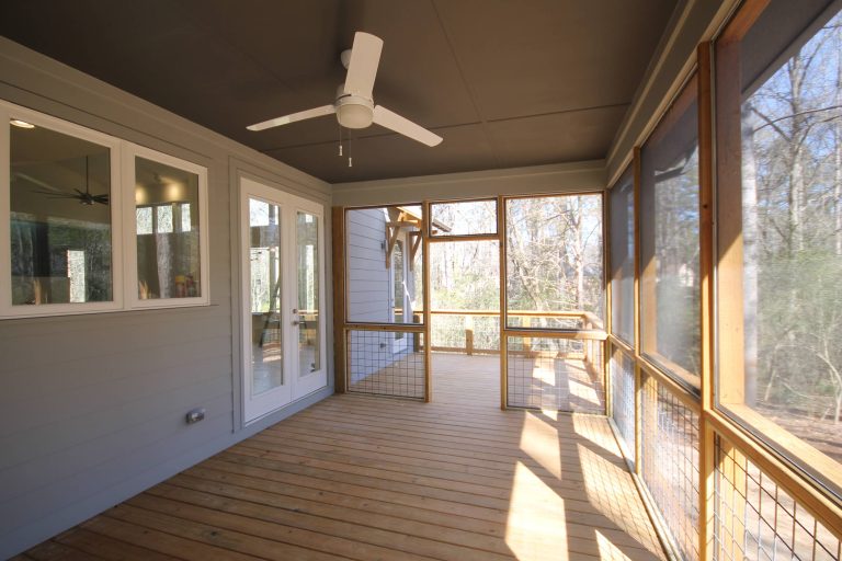Screened Porch with open horse panel railing.