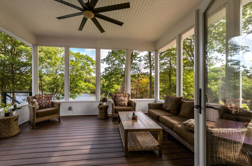 Screened-in back porch photo in Bridgeport with decking and a roof extension by Janine Lamontagne Photography LLC | Outdoor Photos | Porch | Landscaping | Landscape Design | Outdoor Living Space | Porch Design Ideas | Outdoor Living Space Ideas | Backyard Design