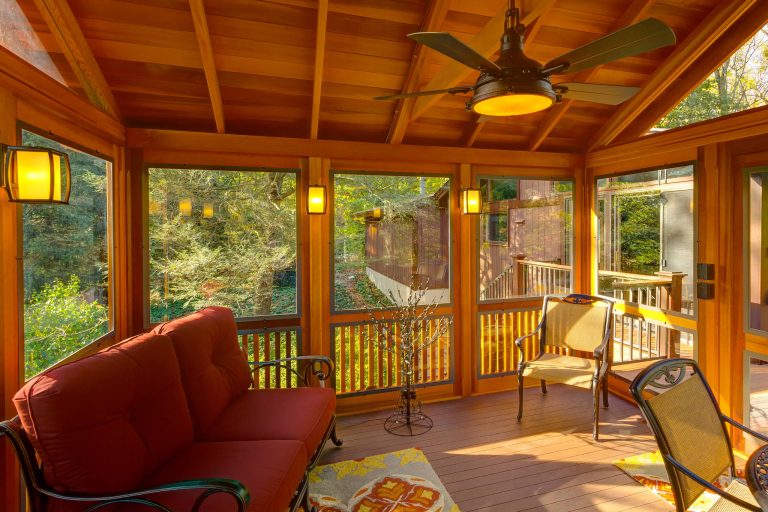 Screened-in back porch photo in Wilmington with decking by DiSabatino Landscaping and Tree Care | Outdoor Photos | Porch | Landscaping | Landscape Design | Outdoor Living Space | Porch Design Ideas | Outdoor Living Space Ideas | Backyard Design