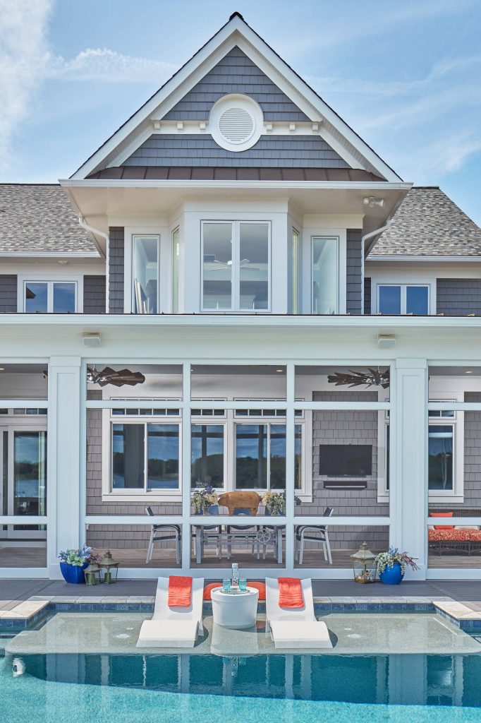 Screened in porch opens into pool area and outdoor kitchen.