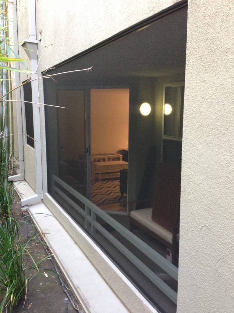 Screened-in side porch idea in Los Angeles with a roof extension by We Screen | Outdoor Photos | Porch | Landscaping | Landscape Design | Outdoor Living Space | Porch Design Ideas | Outdoor Living Space Ideas | Backyard Design