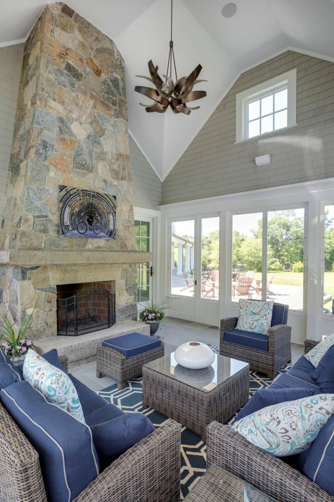 Screened porch with field stone fireplace. Photography: Greg Premru