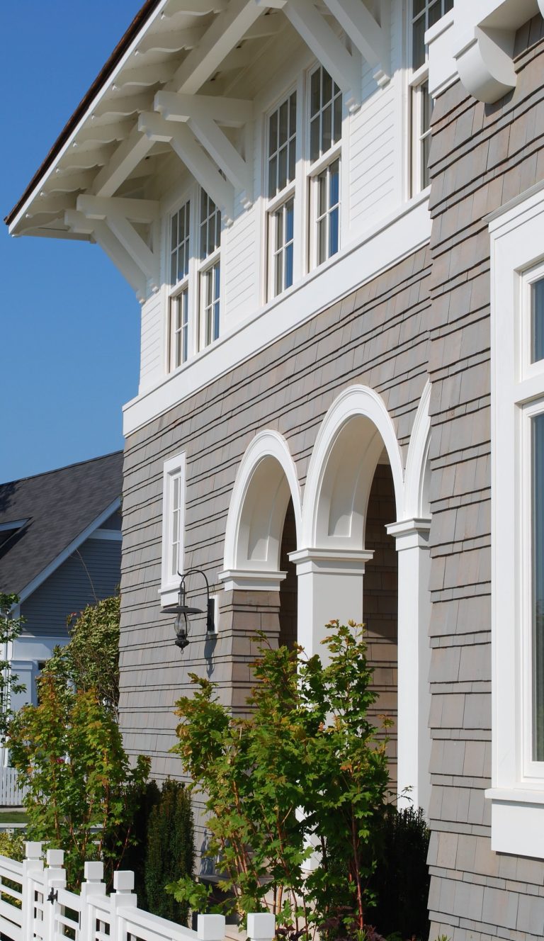 Seabrook Beach House - arched loggia for exterior living space. Photography by Duncan McRoberts