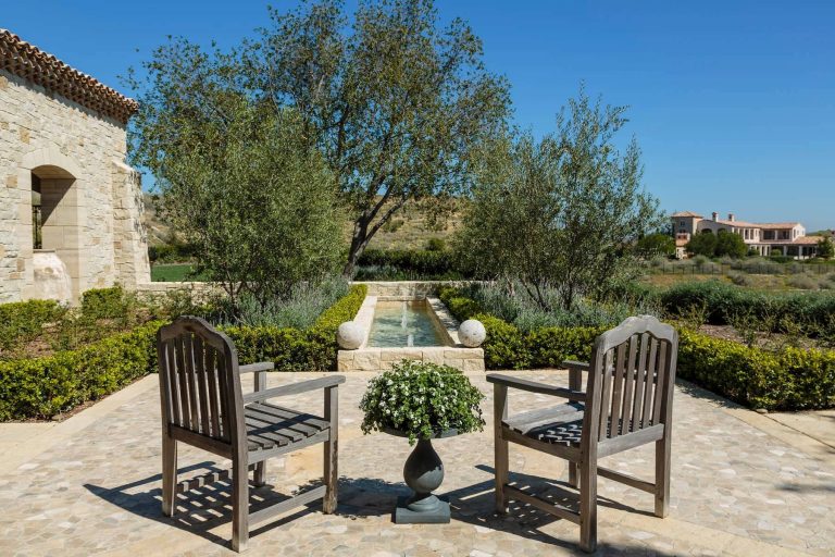 Secluded outdoor place facing a custom built water fountain.