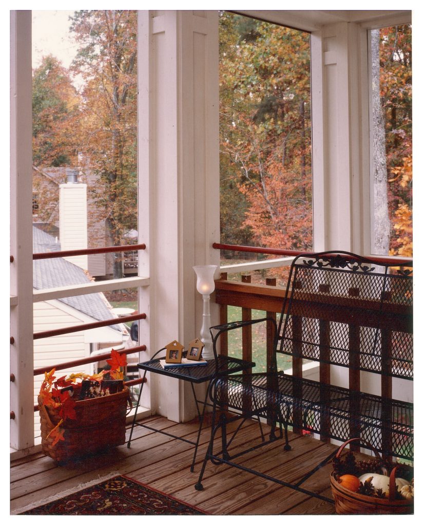 Second story screened porch off the master bedroom provides a perfect place for morning coffee.
