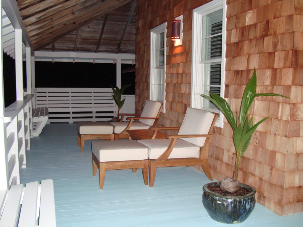 Side porch of customized historic renovation by Charley Pereira, Beach Design & Construction, Inc.