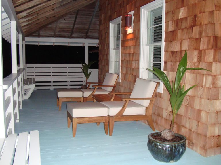 Side porch of customized historic renovation by Charley Pereira, Beach Design & Construction, Inc.