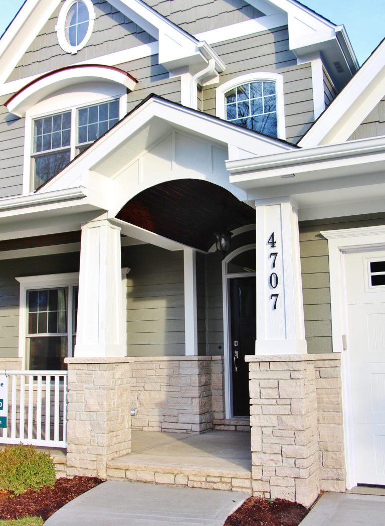 Small arts and crafts concrete front porch photo in Chicago with a roof extension by Cypress Hill Development LLC | Outdoor Photos | Porch | Landscaping | Landscape Design | Outdoor Living Space | Porch Design Ideas | Outdoor Living Space Ideas | Backyard Design