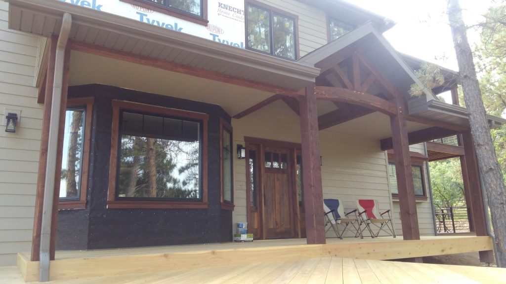 Small arts and crafts front porch idea in Other with decking and a roof extension by Black Hills Craftsmen | Outdoor Photos | Porch | Landscaping | Landscape Design | Outdoor Living Space | Porch Design Ideas | Outdoor Living Space Ideas | Backyard Design