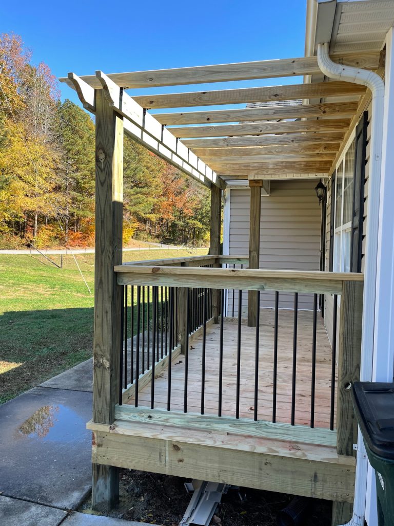 Small arts and crafts metal railing front porch photo in Atlanta with a pergola by Cole Pelfrey Construction | Outdoor Photos | Porch | Landscaping | Landscape Design | Outdoor Living Space | Porch Design Ideas | Outdoor Living Space Ideas | Backyard Design