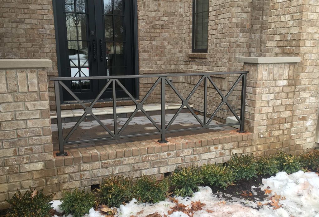 Small elegant brick front porch photo in Detroit with a roof extension by Great Lakes Metal Fabrication | Outdoor Photos | Porch | Landscaping | Landscape Design | Outdoor Living Space | Porch Design Ideas | Outdoor Living Space Ideas | Backyard Design