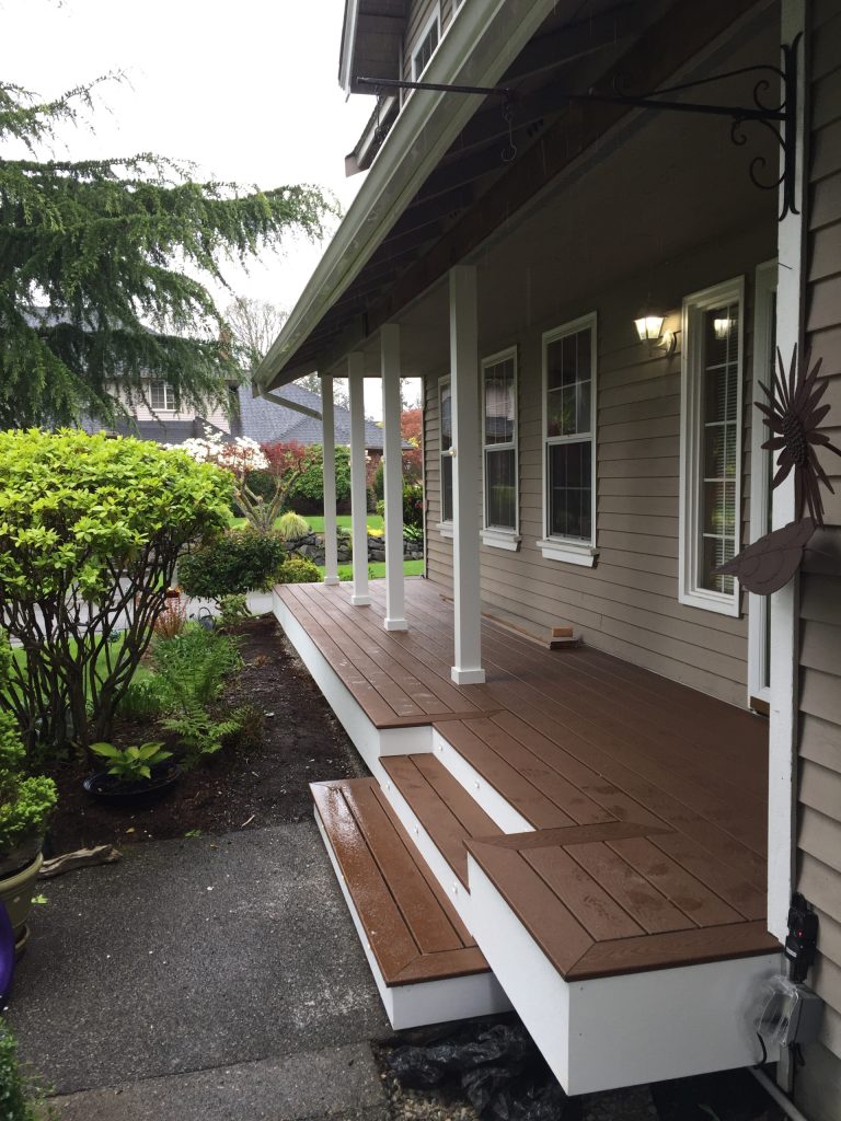 Small elegant front porch photo in Seattle with decking and a roof extension by Chapman Construction, LLC | Outdoor Photos | Porch | Landscaping | Landscape Design | Outdoor Living Space | Porch Design Ideas | Outdoor Living Space Ideas | Backyard Design