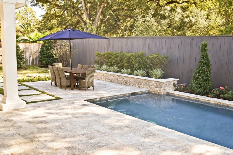 Small minimalist backyard stone patio kitchen photo in Houston with no cover