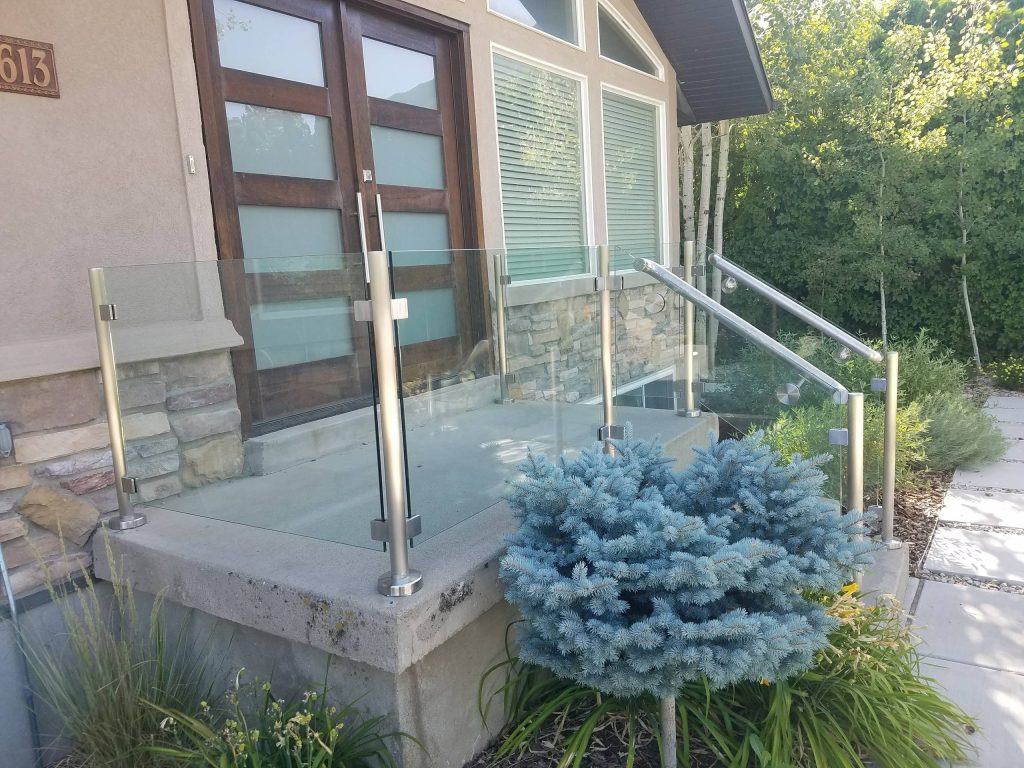 Small minimalist concrete front porch idea in Salt Lake City by Glass Crafters of Utah | Outdoor Photos | Porch | Landscaping | Landscape Design | Outdoor Living Space | Porch Design Ideas | Outdoor Living Space Ideas | Backyard Design